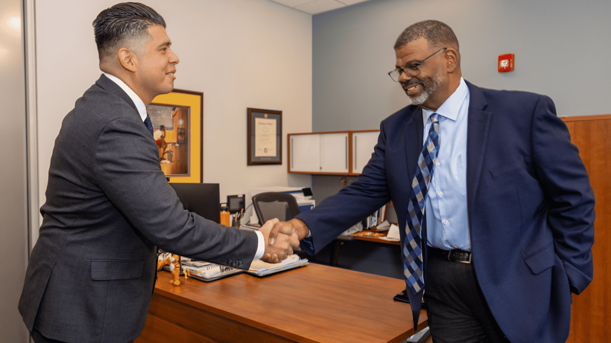 james and dr.bishop shaking hands james and dr.bishop shaking hands