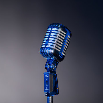 Blue microphone in spotlight
