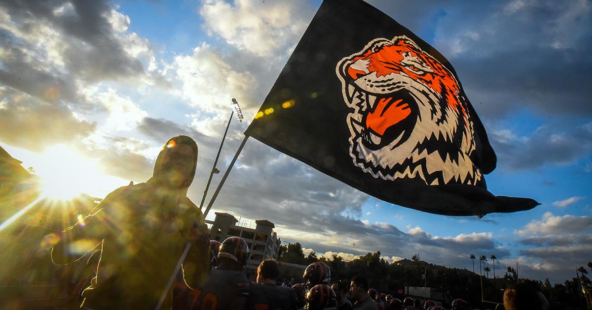 RCC student holding Tiger flag