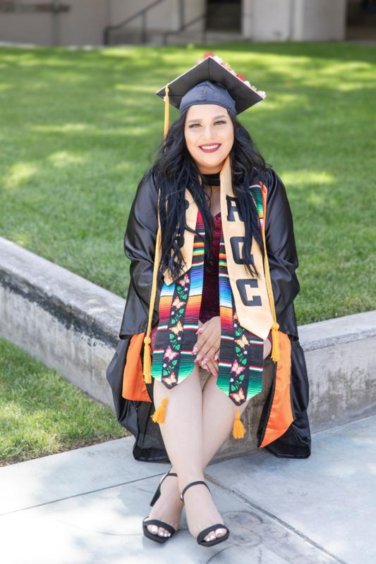 Emily Fuentes in graduation regalia