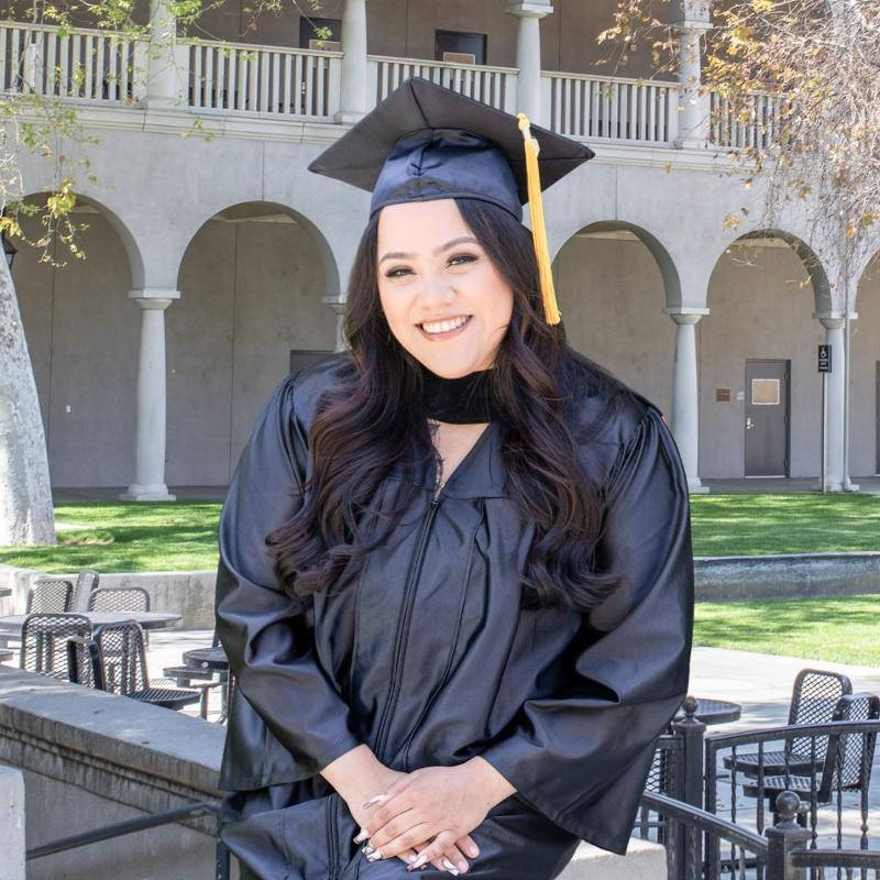 Rachel Rangel Leon in graduation regalia